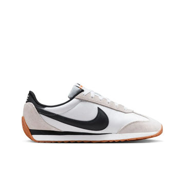 Nike Revolution 8 men's sneakers, featuring a breathable mesh upper and foam midsole for cushioning, with a weight of approximately 292g and a 10mm drop, perfect for running and casual wear in Midnight Navy/White/Black/Pure P