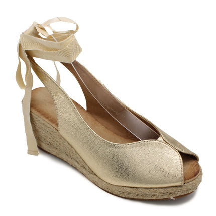 Soraia shoes. Wedge of jute and synthetic leather or anelline with bow trim and elastic fit to the ankle. Women's sandals. PlatiNum
