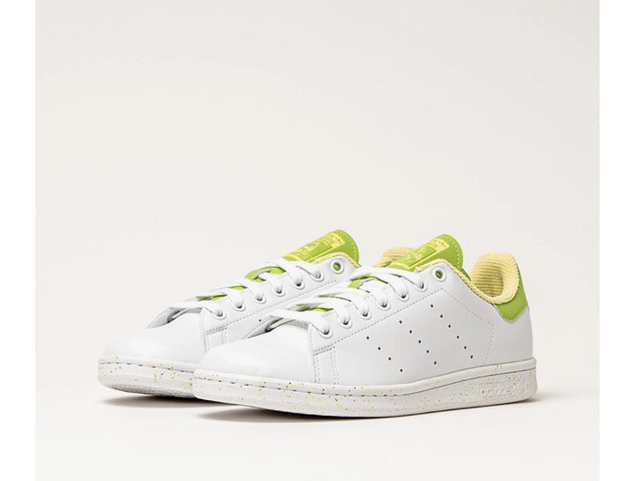 Adidas Stan Smith Disney Tiana and the Frog limited edition women's sneakers, featuring a classic white upper with green accents, comfortable lightweight cushioning, and a sustainable sole made from recycled materials. PlatiNum