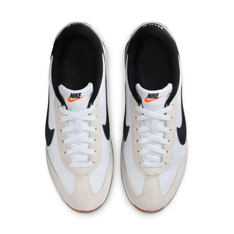 Nike Revolution 8 men's sneakers, featuring a breathable mesh upper and foam midsole for cushioning, with a weight of approximately 292g and a 10mm drop, perfect for running and casual wear in Midnight Navy/White/Black/Pure P