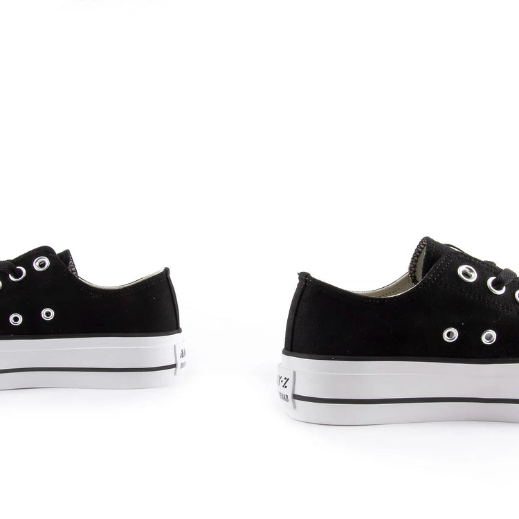 White canvas shoes with platform sole for women, featuring lace closure and comfortable textile lining, ideal for casual and outdoor use, perfect as versatile footwear. PlatiNum
