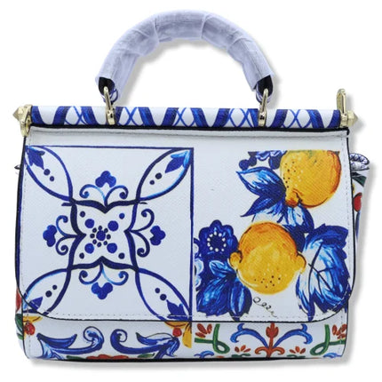 Borsa a tracolla con manico, decorazione in Maioliche siciliane e Limoni su sfondo bianco, disponibile in 2 misure.