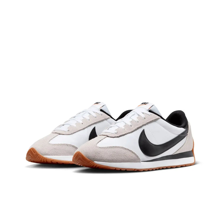 Nike Revolution 8 men's sneakers, featuring a breathable mesh upper and foam midsole for cushioning, with a weight of approximately 292g and a 10mm drop, perfect for running and casual wear in Midnight Navy/White/Black/Pure P