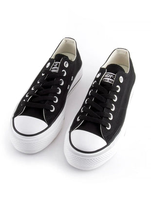 White canvas shoes with platform sole for women, featuring lace closure and comfortable textile lining, ideal for casual and outdoor use, perfect as versatile footwear. PlatiNum