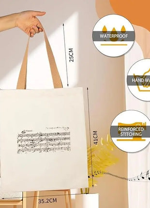 Borsa tote con cerniera dal design ispirato a Mozart e alle partiture di musica classica. Ampia capacità e design compatto.