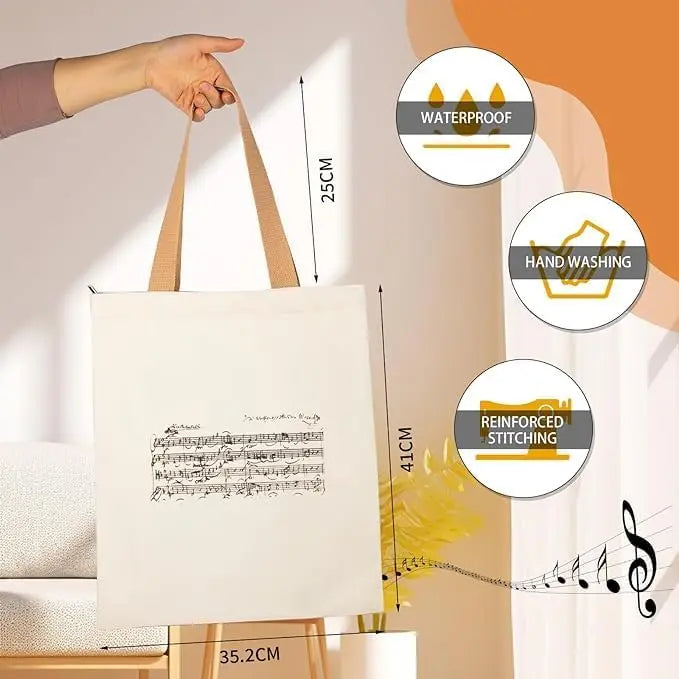 Borsa tote con cerniera dal design ispirato a Mozart e alle partiture di musica classica. Ampia capacità e design compatto.