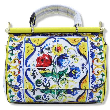 Borsa a tracolla con manico, decorata con Maioliche siciliane e fiori su sfondo giallo, disponibile in 2 misure.