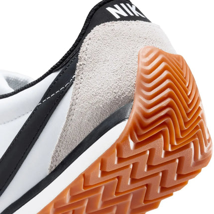 Nike Revolution 8 men's sneakers, featuring a breathable mesh upper and foam midsole for cushioning, with a weight of approximately 292g and a 10mm drop, perfect for running and casual wear in Midnight Navy/White/Black/Pure P