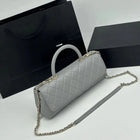 Borsa a tracolla cilindrica in maglia grigia con motivo a rombi, in pelle PU liscia, tracolla multiuso rimovibile, stile minimalista ed elegante.