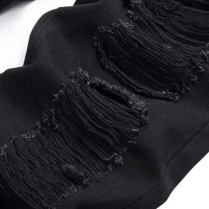 Single piece of trendy streetwear: straight-cut ripped denim jeans in black. PlatiNum