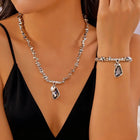 Set di bracciali con collana con pendente in cristallo grigio irregolare semplice barocco Set di gioielli con perline color argento estetico delicato per donna uomo platinumshop
