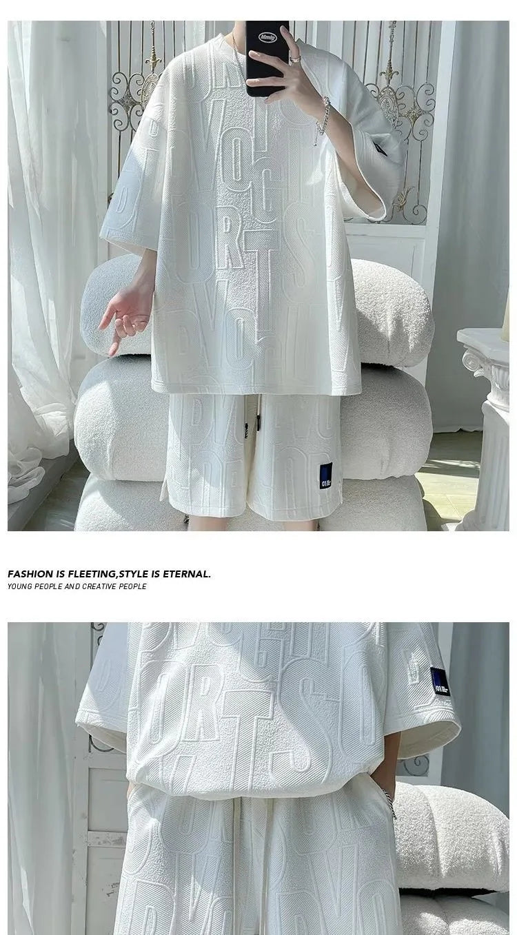 Abito di moda maschile bello set con pantaloncini a maniche corte jacquard sportivi casual larghi Set da due pezzi 2025 Primavera ed estate platinumshop