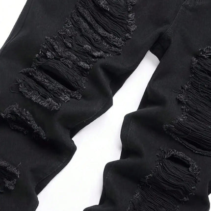 Single piece of trendy streetwear: straight-cut ripped denim jeans in black. PlatiNum