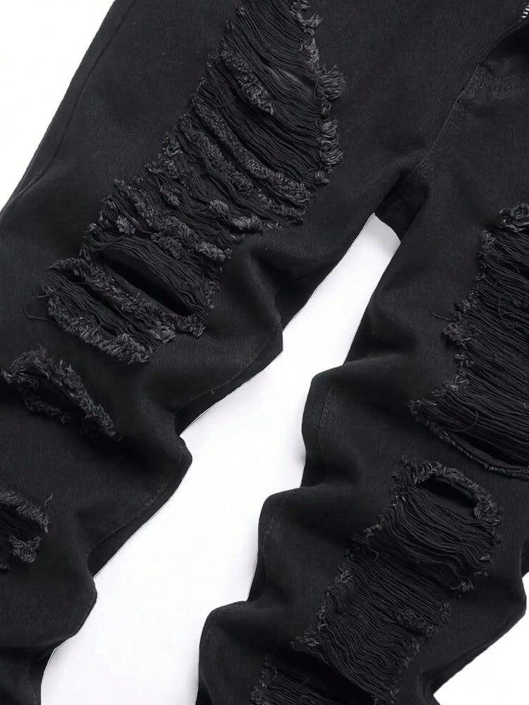 Single piece of trendy streetwear: straight-cut ripped denim jeans in black. PlatiNum