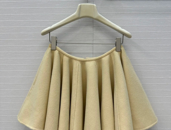 A light yellow high-waisted short skirt with ruffled edges and a double-sided wool A-line skirt, looking cute and playful PlatiNum
