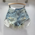 Pantaloncini di jeans con foro rosa delle nuove donne estive 2026 a vita alta che dimagriscono pantaloncini con bordo sfilacciato a trapezio per ragazza piccante - platinumshop