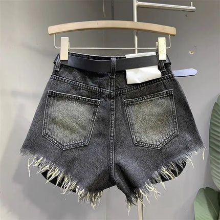 New style ripped denim shorts with frayed washed pockets and wide legs