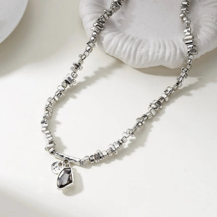 Set di bracciali con collana con pendente in cristallo grigio irregolare semplice barocco Set di gioielli con perline color argento estetico delicato per donna uomo platinumshop