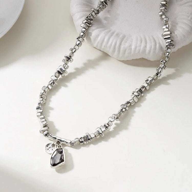 Set di bracciali con collana con pendente in cristallo grigio irregolare semplice barocco Set di gioielli con perline color argento estetico delicato per donna uomo platinumshop