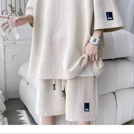Abito di moda maschile bello set con pantaloncini a maniche corte jacquard sportivi casual larghi Set da due pezzi 2025 Primavera ed estate platinumshop