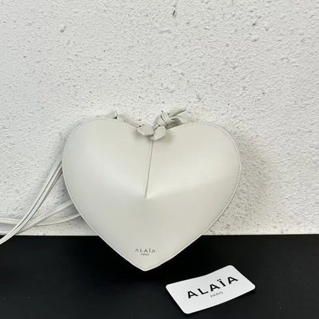 Borsa a tracolla da donna alla moda, a forma di cuore, in vera pelle, morbida e liscia, leggera, casual, per esterni, con scomparti interni.
