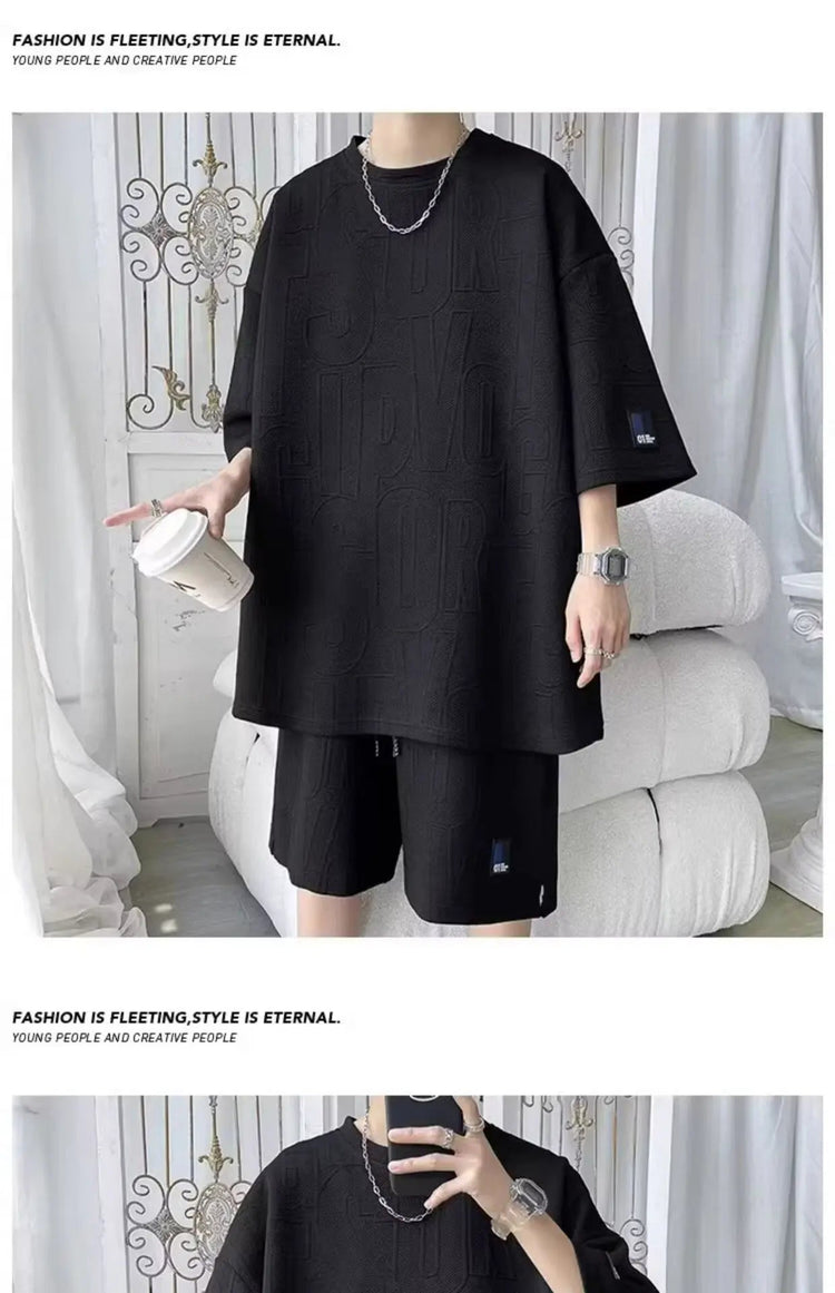 Abito di moda maschile bello set con pantaloncini a maniche corte jacquard sportivi casual larghi Set da due pezzi 2025 Primavera ed estate platinumshop