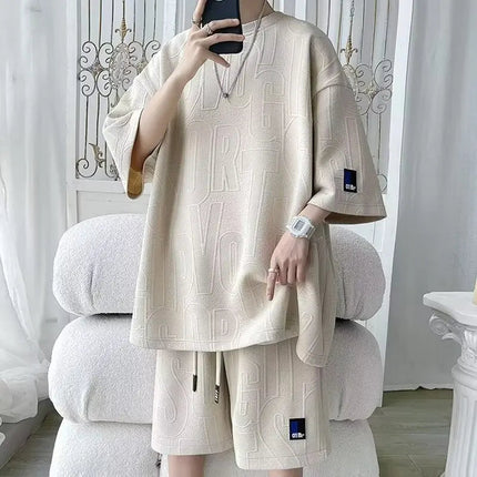 Abito di moda maschile bello set con pantaloncini a maniche corte jacquard sportivi casual larghi Set da due pezzi 2025 Primavera ed estate platinumshop