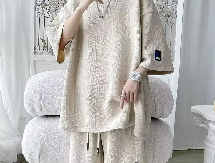 Abito di moda maschile bello set con pantaloncini a maniche corte jacquard sportivi casual larghi Set da due pezzi 2025 Primavera ed estate platinumshop