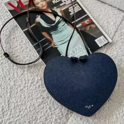 Borsa a tracolla da donna alla moda, a forma di cuore, in vera pelle, morbida e liscia, leggera, casual, per esterni, con scomparti interni.