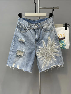 Pantaloncini di jeans con foro sfilacciato floreale con perline alla moda Pantaloncini casual estivi da donna a vita alta in tinta unita stile coreano