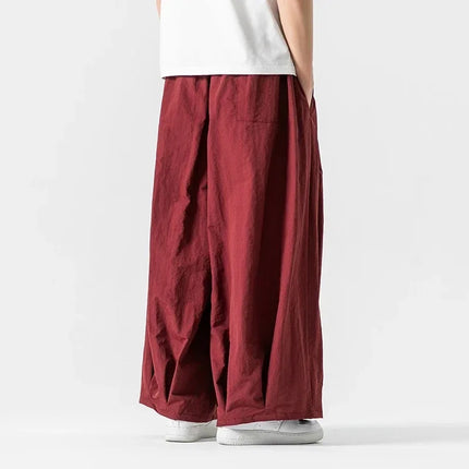 Pantaloni cargo da uomo Pantaloni casual stile giapponese Harajuku Moda allentata maschile Harem Pantaloni a gamba larga in vita elastica Uomo Nuovo streetwear