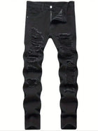 Single piece of trendy streetwear: straight-cut ripped denim jeans in black. PlatiNum
