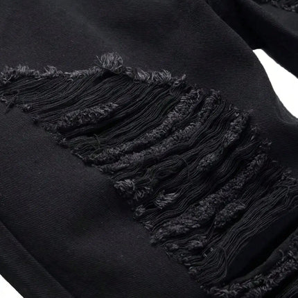 Single piece of trendy streetwear: straight-cut ripped denim jeans in black. PlatiNum