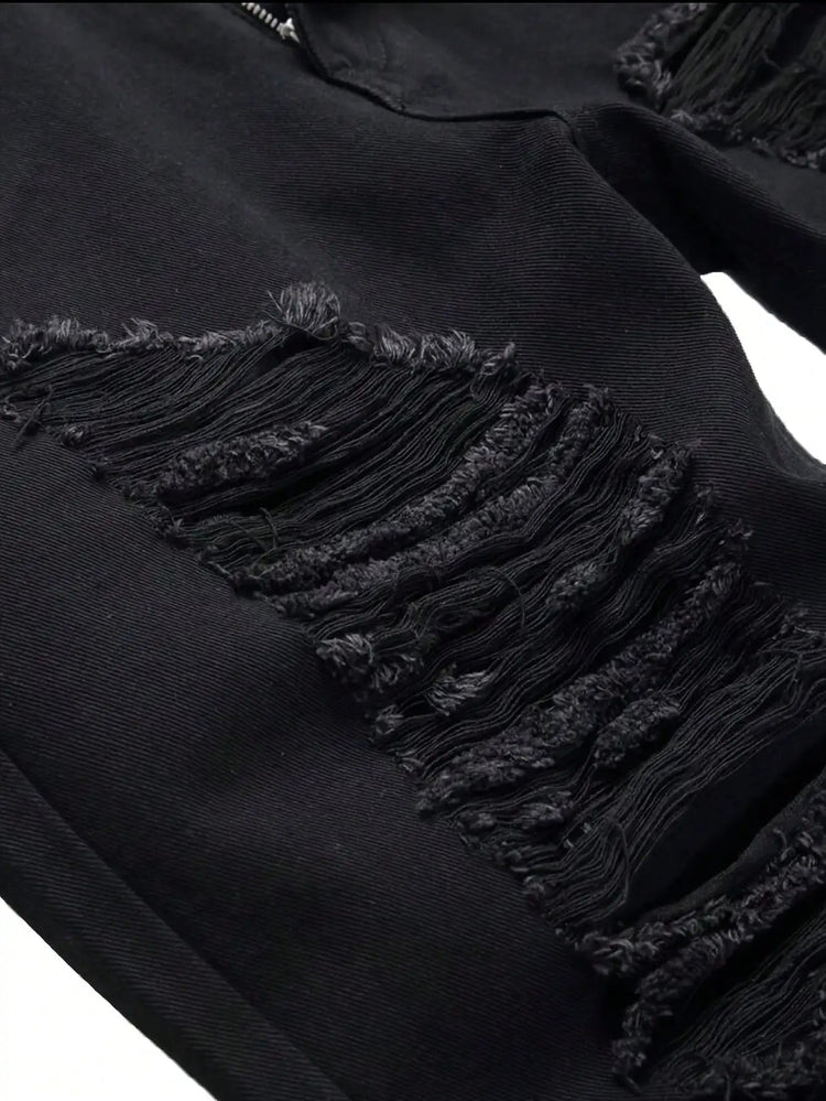 Single piece of trendy streetwear: straight-cut ripped denim jeans in black. PlatiNum