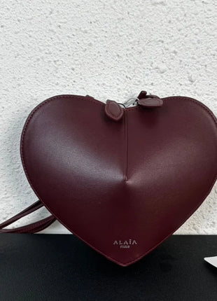 Borsa a tracolla da donna alla moda, a forma di cuore, in vera pelle, morbida e liscia, leggera, casual, per esterni, con scomparti interni.