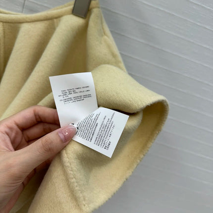 A light yellow high-waisted short skirt with ruffled edges and a double-sided wool A-line skirt, looking cute and playful PlatiNum