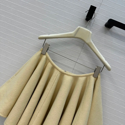 A light yellow high-waisted short skirt with ruffled edges and a double-sided wool A-line skirt, looking cute and playful PlatiNum