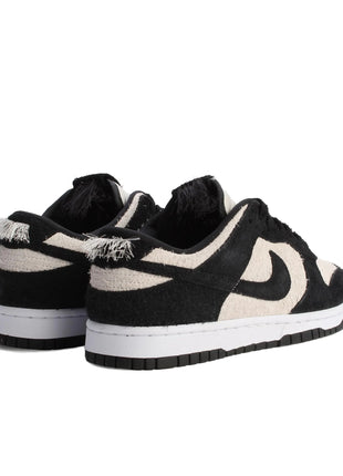 Scarpe da skateboard Nike Dunk da uomo bianche nere IB2990-100