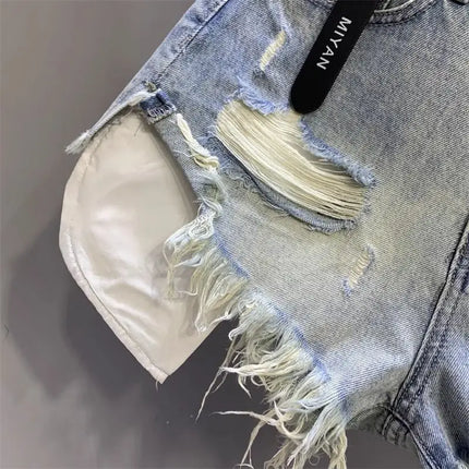 New style ripped denim shorts with frayed washed pockets and wide legs