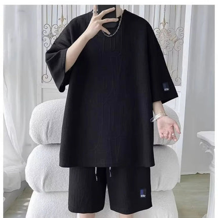 Abito di moda maschile bello set con pantaloncini a maniche corte jacquard sportivi casual larghi Set da due pezzi 2025 Primavera ed estate platinumshop