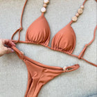 Costumi da bagno solidi Sexy Halter Triangolo Bead String Bikini 2026 Nuovo Mini Micro Perizoma Costume da bagno Donna Estate Bikini brasiliani Set