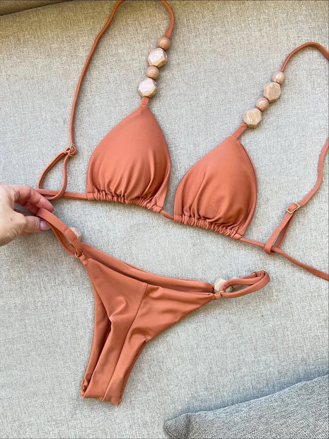 Costumi da bagno solidi Sexy Halter Triangolo Bead String Bikini 2026 Nuovo Mini Micro Perizoma Costume da bagno Donna Estate Bikini brasiliani Set
