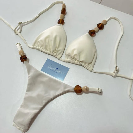 Costumi da bagno solidi Sexy Halter Triangolo Bead String Bikini 2026 Nuovo Mini Micro Perizoma Costume da bagno Donna Estate Bikini brasiliani Set