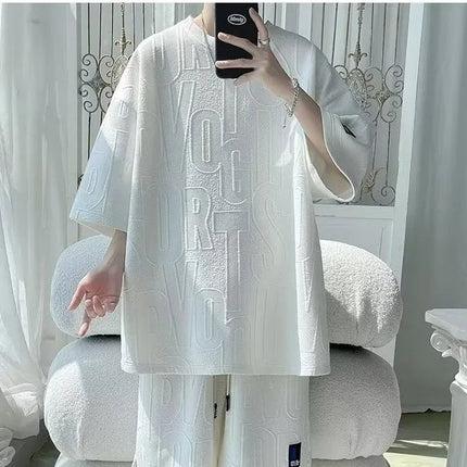 Abito di moda maschile bello set con pantaloncini a maniche corte jacquard sportivi casual larghi Set da due pezzi 2025 Primavera ed estate platinumshop