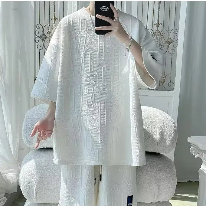 Abito di moda maschile bello set con pantaloncini a maniche corte jacquard sportivi casual larghi Set da due pezzi 2025 Primavera ed estate platinumshop