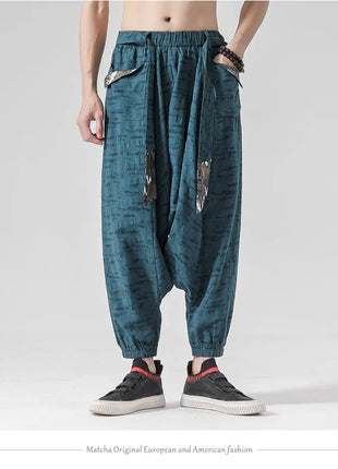 Pantaloni a gamba larga da uomo in cotone e lino casual oversize Harajuku pantaloni alla moda da uomo samurai giapponese retrò Ukiyo-e stampa pantaloni con cintura da uomo