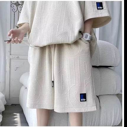 Abito di moda maschile bello set con pantaloncini a maniche corte jacquard sportivi casual larghi Set da due pezzi 2025 Primavera ed estate platinumshop