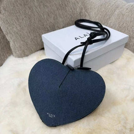 Borsa a tracolla da donna alla moda, a forma di cuore, in vera pelle, morbida e liscia, leggera, casual, per esterni, con scomparti interni.