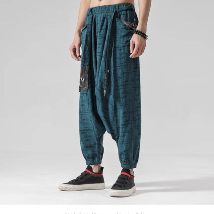 Pantaloni a gamba larga da uomo in cotone e lino casual oversize Harajuku pantaloni alla moda da uomo samurai giapponese retrò Ukiyo-e stampa pantaloni con cintura da uomo