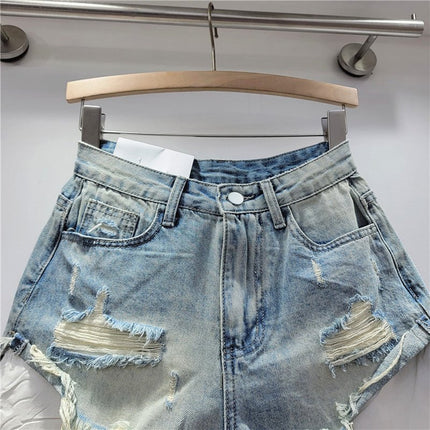 Pantaloncini di jeans con foro rosa delle nuove donne estive 2026 a vita alta che dimagriscono pantaloncini con bordo sfilacciato a trapezio per ragazza piccante - platinumshop